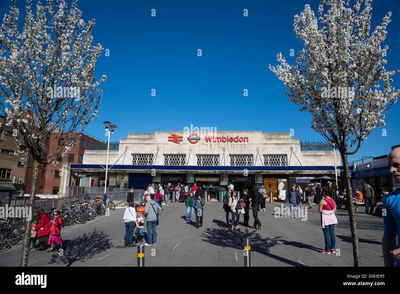 Wimbledon train station with two trees in blossom, London, UK Stock