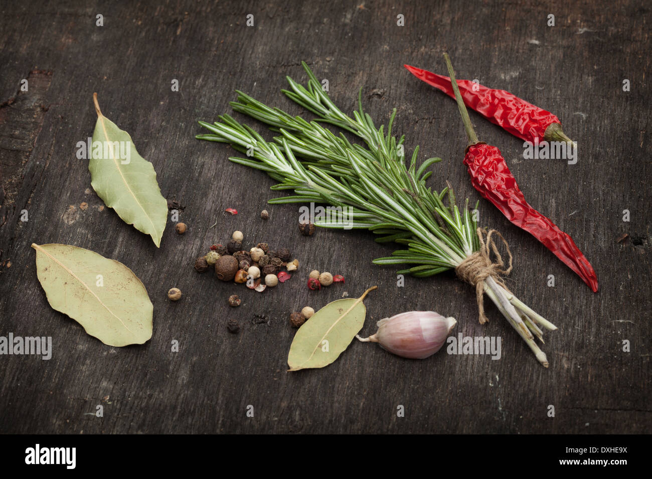 Herbs and spices over old wood table background Stock Photo