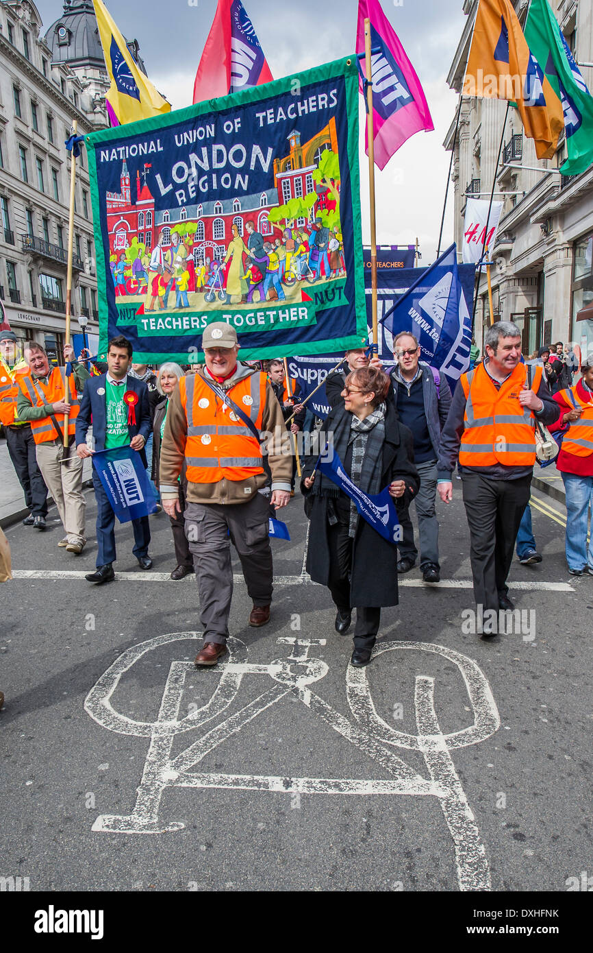 London, UK . 26th Mar, 2014. On your bike. The NUT leads a national strike action in England and Wales. Marches and rallies are being held around the country, including this one from Broadcasting House to Downing Street, Whitehall. The union says the action is being taken against: Excessive workload and bureaucratic; Performance related pay and in defence of a national pay scale system; Unfair pension changes. Credit:  Guy Bell/Alamy Live News Stock Photo