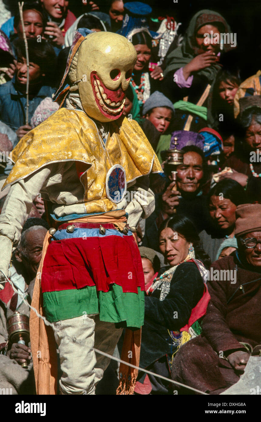 Monk dancing the Cham dance wearing a Wrathful deity mask and costume typical of Tibetan Buddhist practice Ladakh India Stock Photo