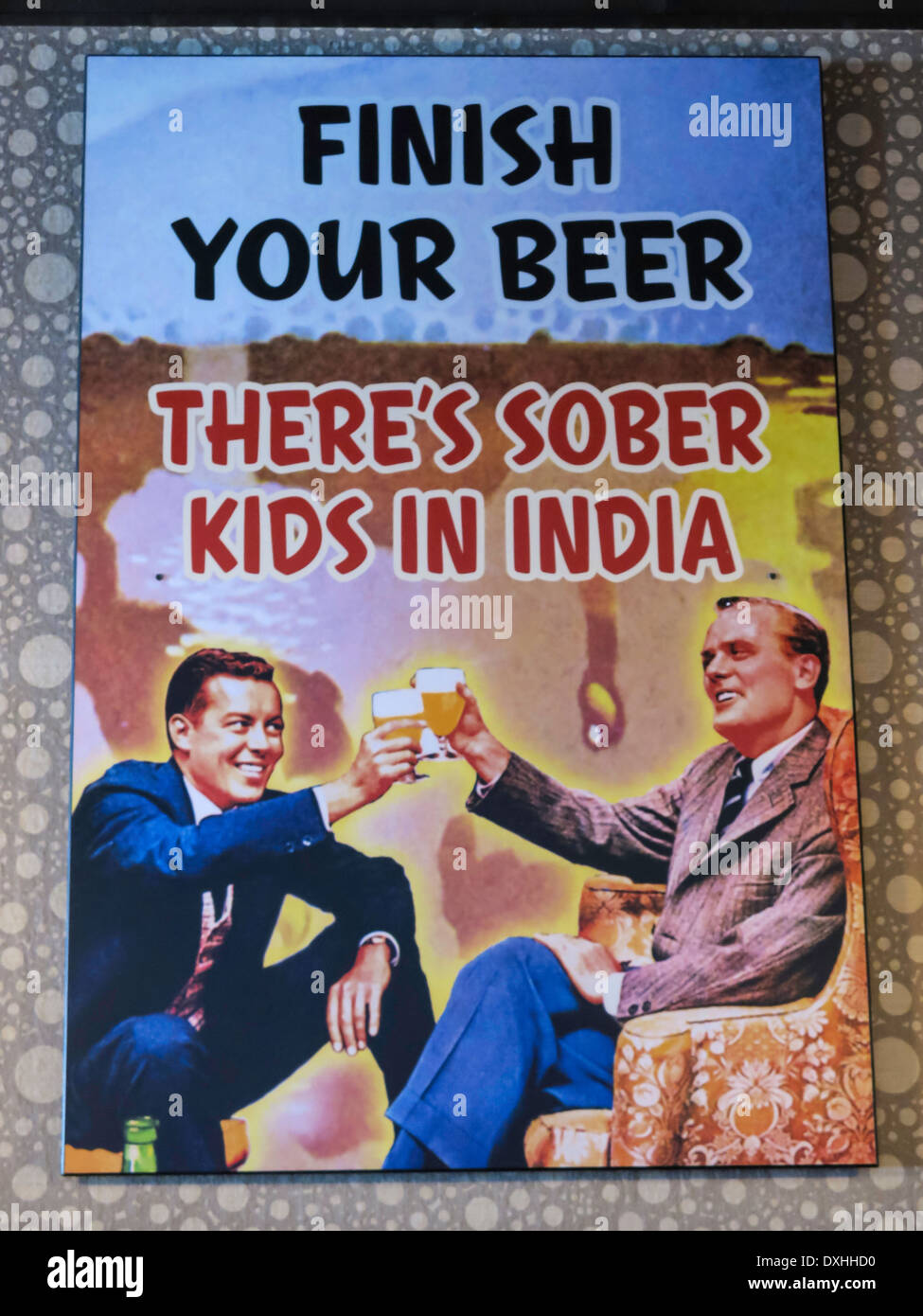 Humorous Bar Sign,'Finish Your Beer, There's Sober Kids In India', Florida, FL, USA Stock Photo