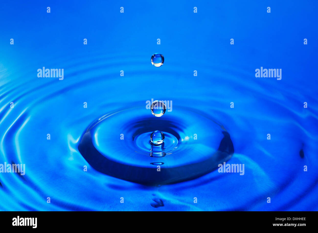 Water droplet falling onto water surface Stock Photo Alamy
