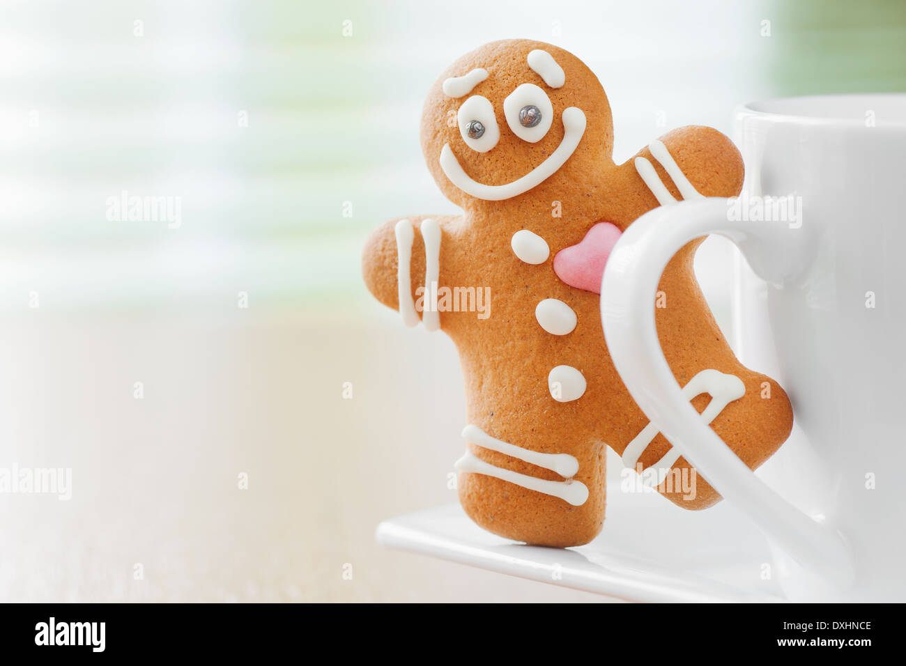 funny gingerbread man peeking out mugs Stock Photo
