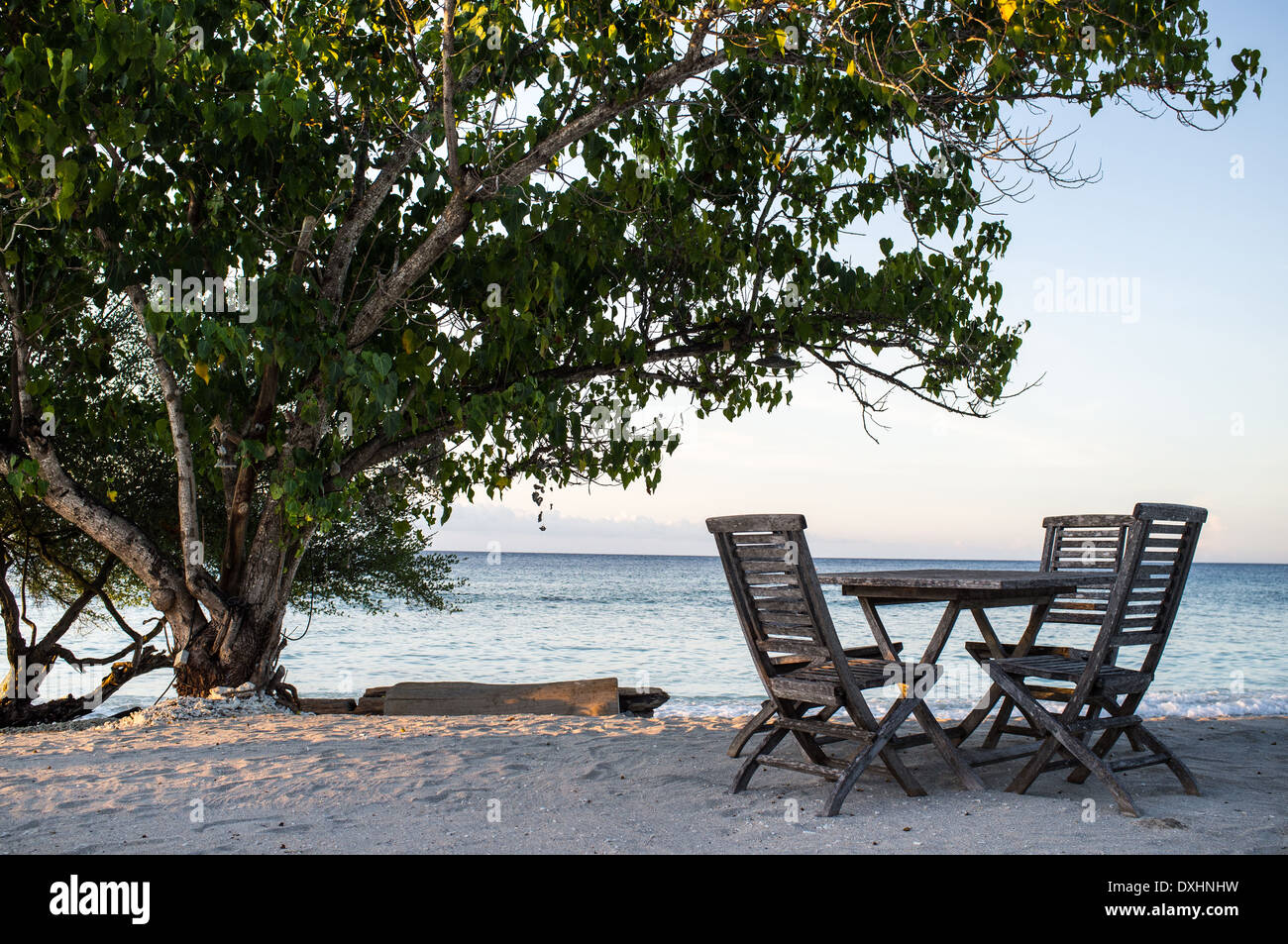 Table and chairs on the beach at a restaurant, Gili Trawangan, Gili Islands, Indonesia, Southeast Asia, Asia Stock Photo