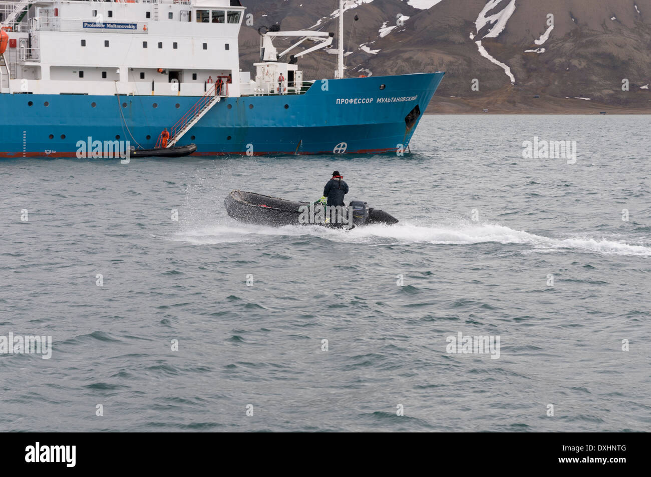 A rubber dingy approaches the Russian cruise ship Professor