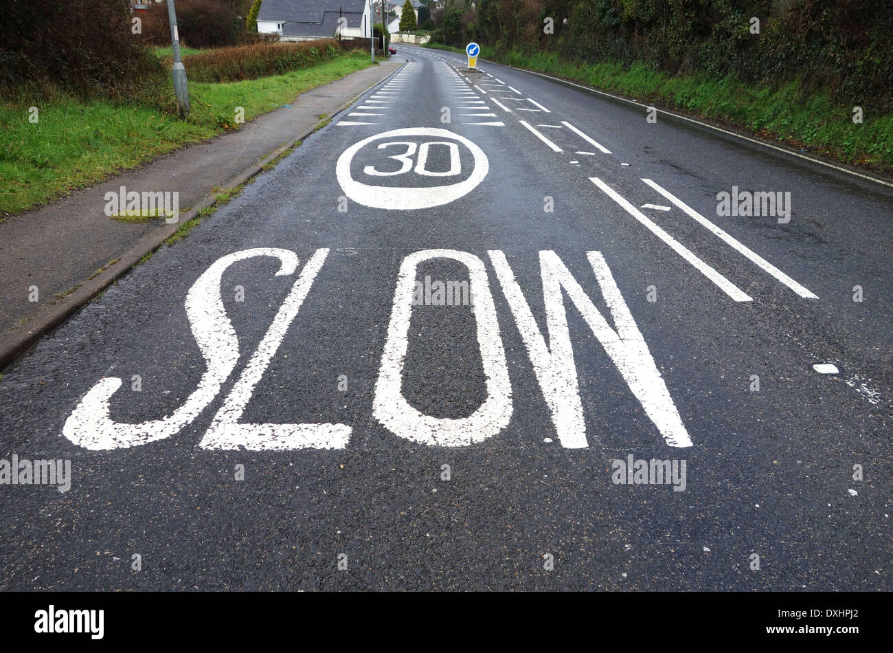 30 mph speed limit sign painted on road Stock Photo