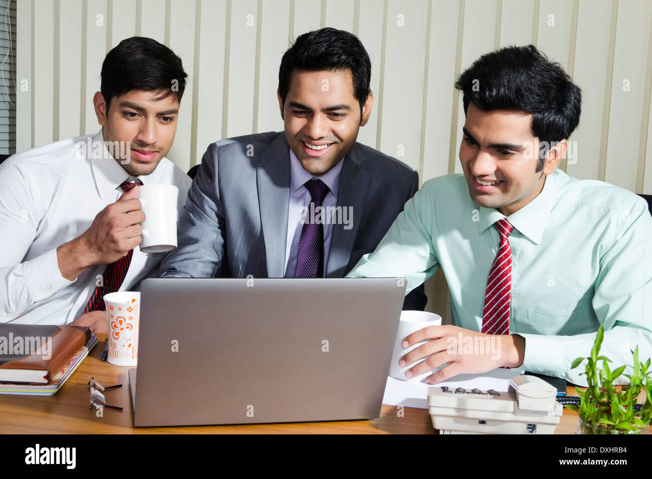 Indian Businessman sitting in Office and Disscussing Stock Photo