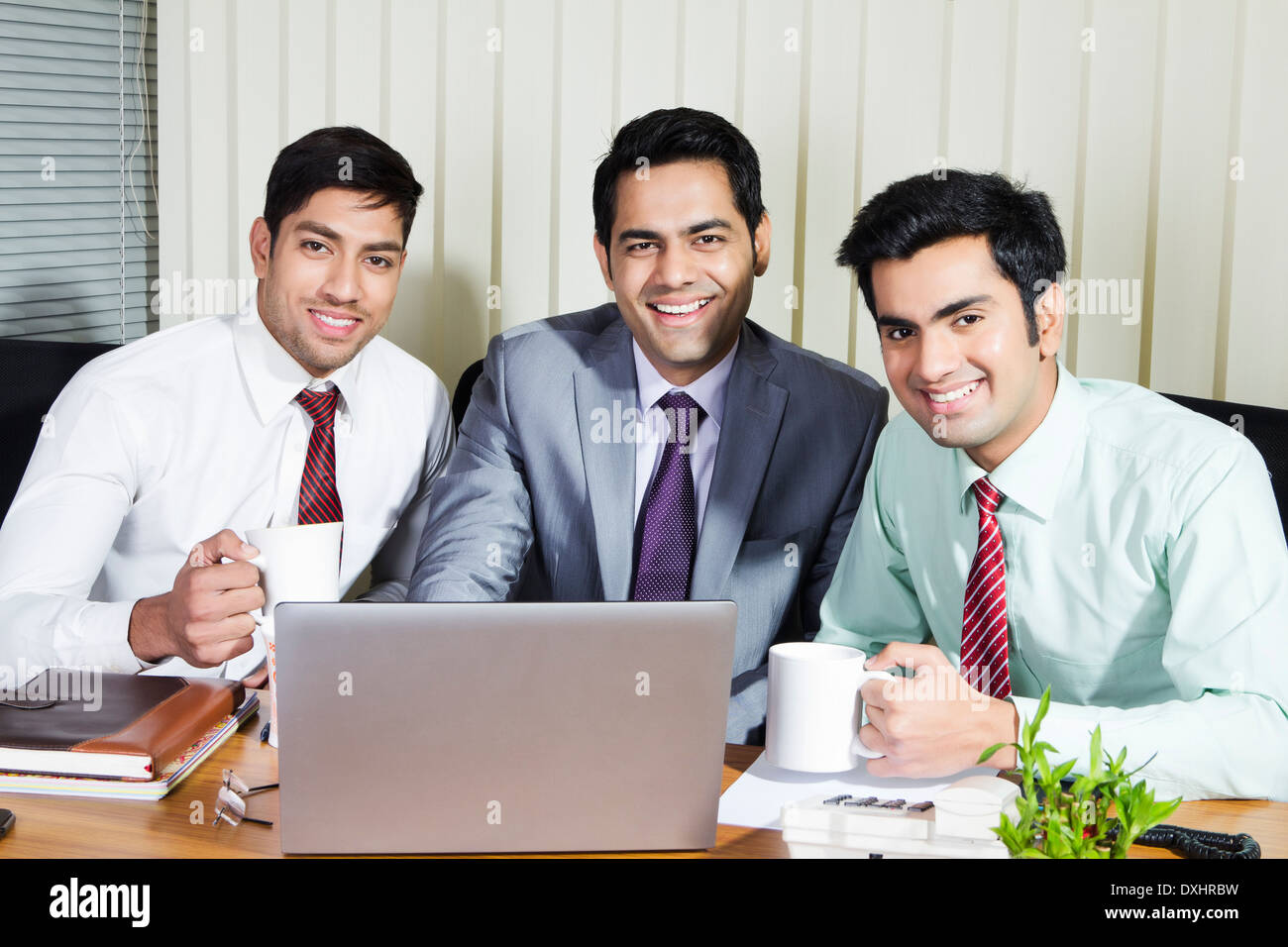 Indian Businessman sitting in Office and Disscussing Stock Photo