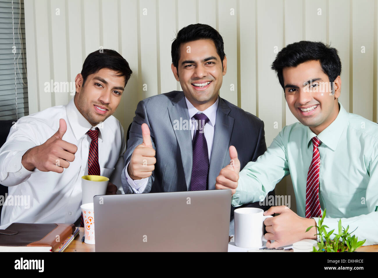 Indian Businessman sitting in Office and Disscussing Stock Photo