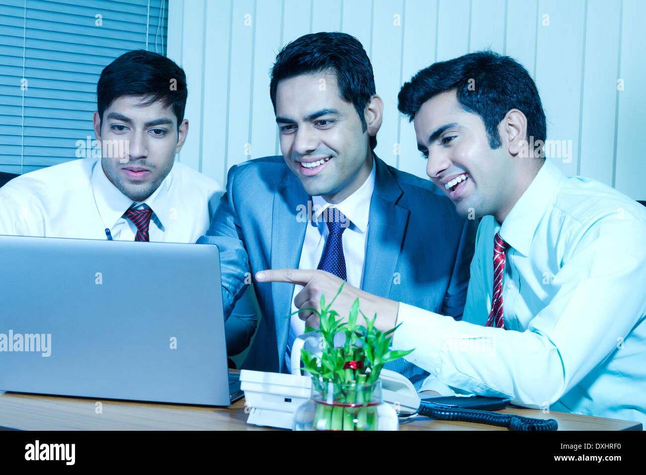 Indian Businessman sitting in Office and Disscussing Stock Photo