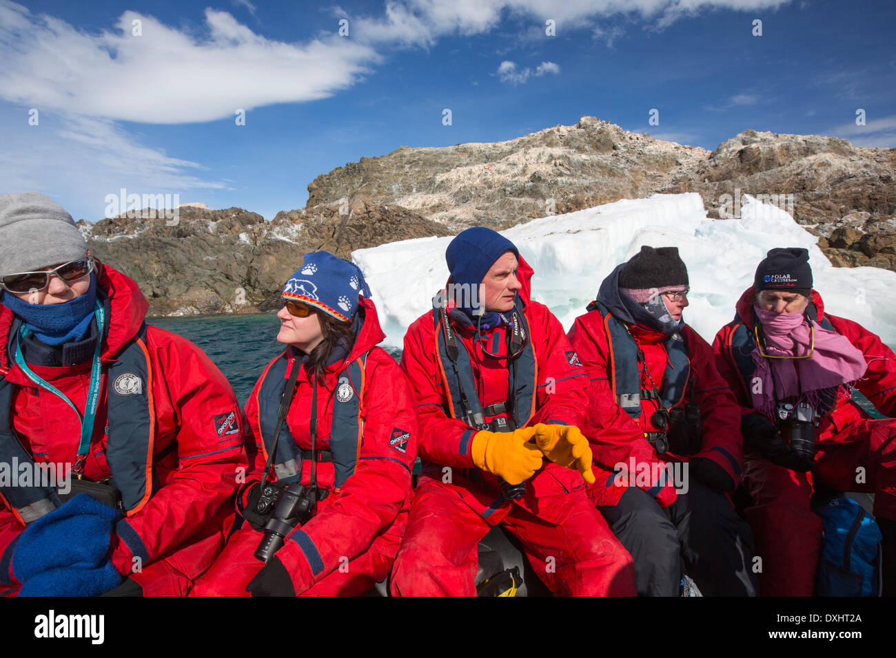 Members of an expedition cruise to Antarctica in a Zodiak off Madder Cliffs on the Antarctic Peninsular. Stock Photo