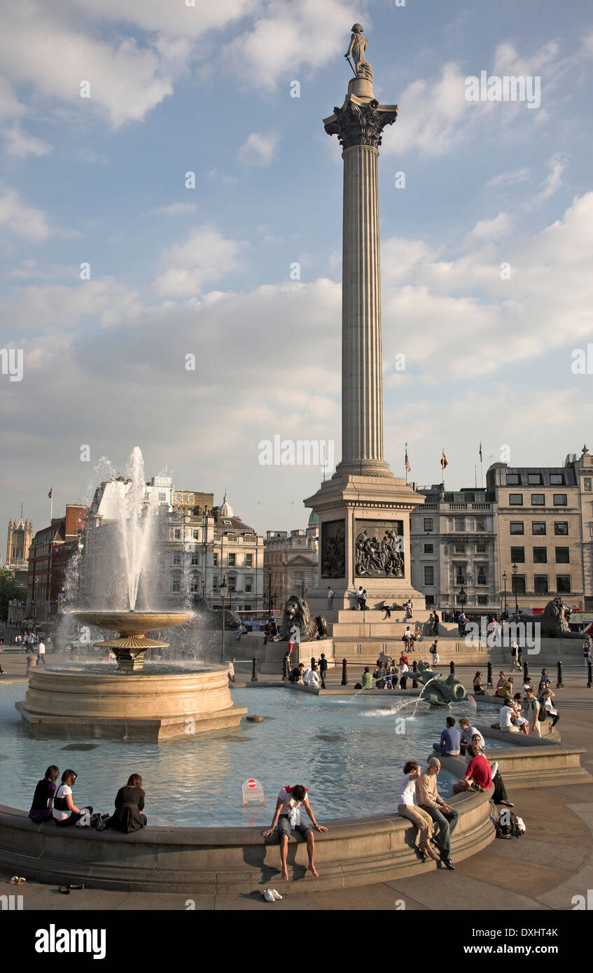People, water fountain and Nelson´s column in Trafalgar Square, London, England Stock Photo