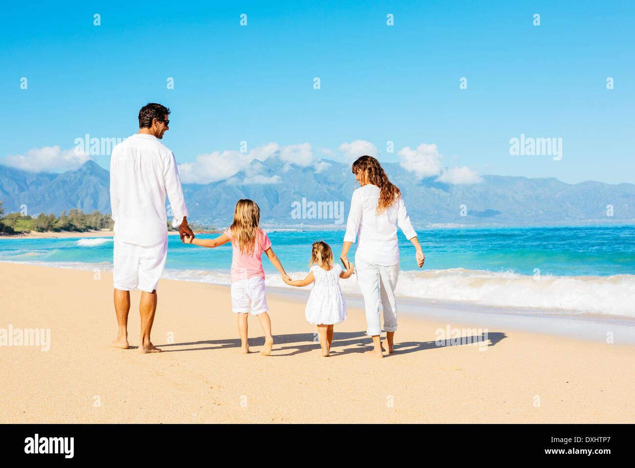 Four people walking on beach hi-res stock photography and images - Alamy