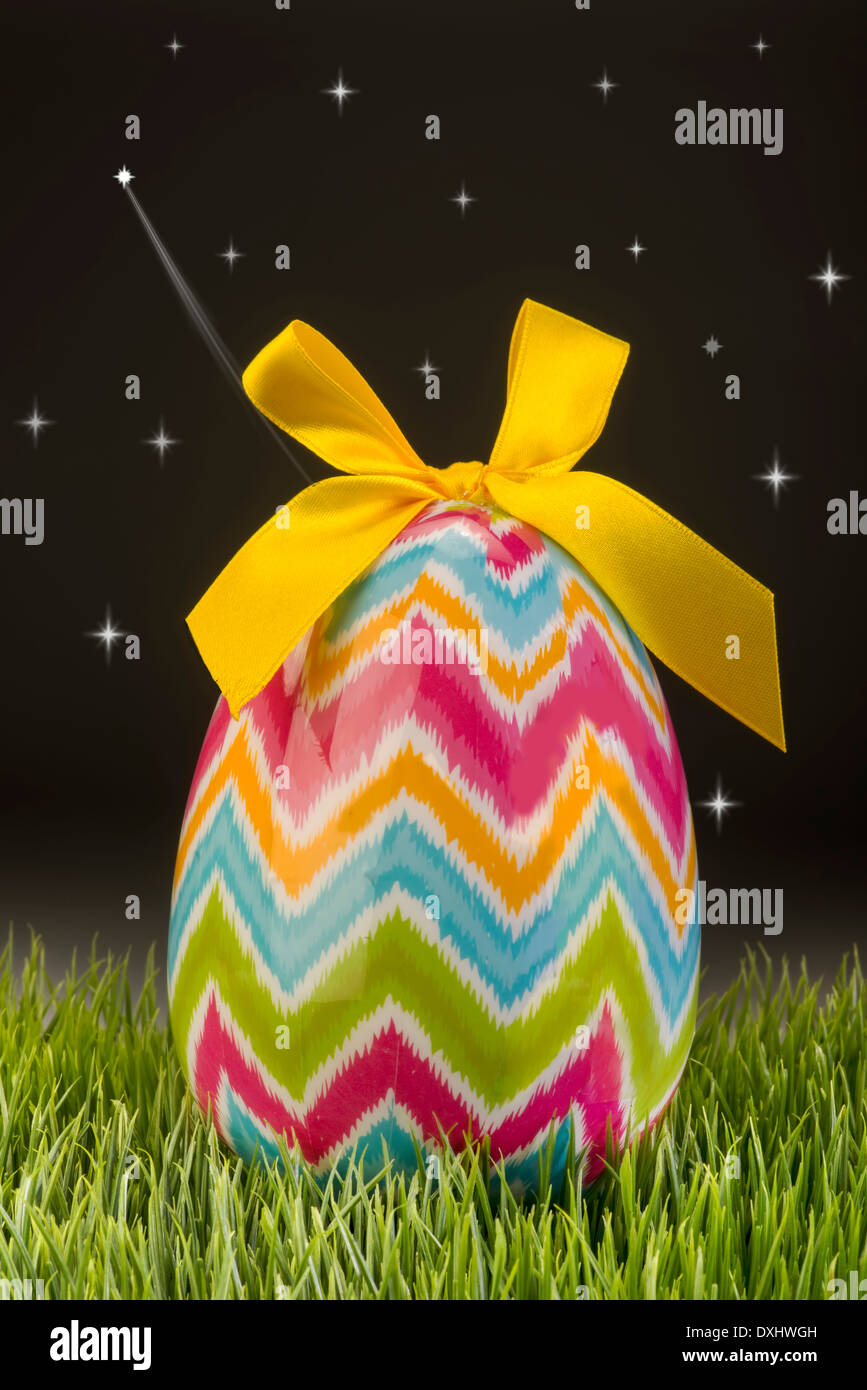 Easter egg at night with stars streaking. Stock Photo