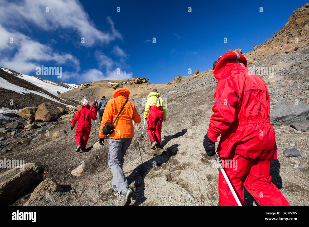 Passengers on an expedition cruise climbing the caldera on Deception Island in the South Shetland Islands off Antarctica Stock Photo