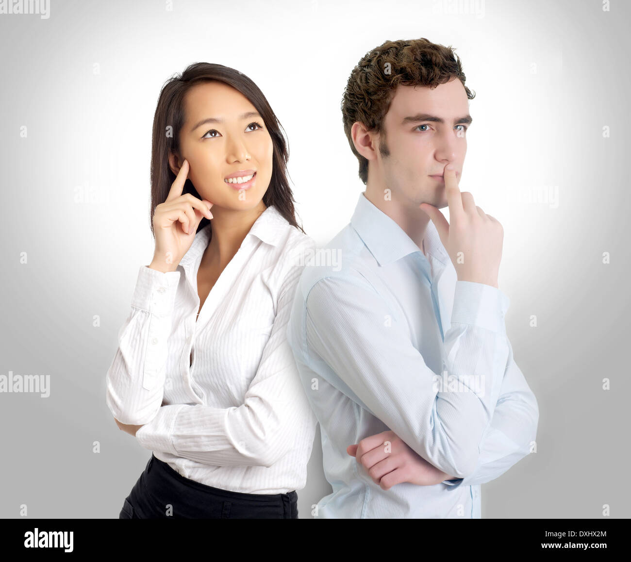 Two creative professionals in thinking pose Stock Photo