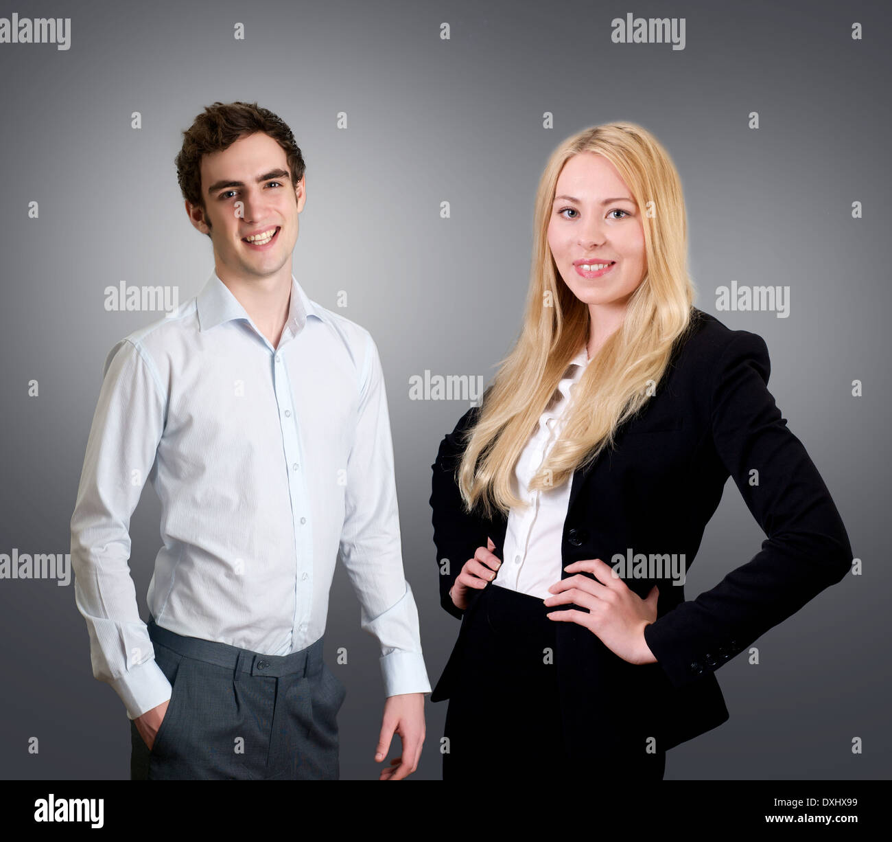 Portrait of smiling business people on grey background Stock Photo - Alamy