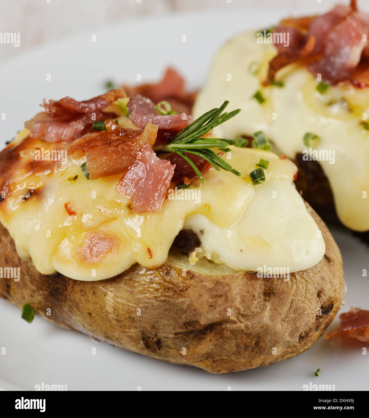 Baked Potatoes With Cheese And Bacon Stock Photo - Alamy