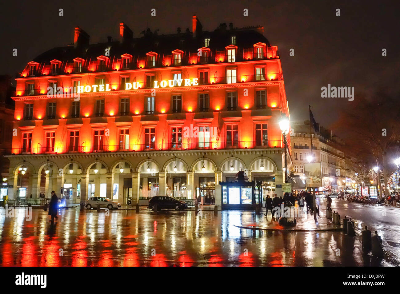 Exterior of the Hotel du Louvre on a wet winter's evening, Paris, France Stock Photo