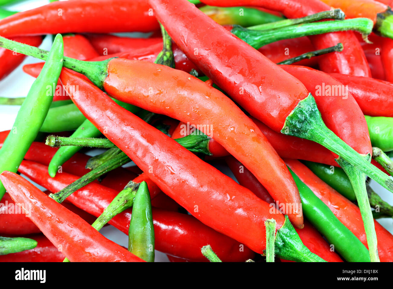 a pile of red chillies for background. Stock Photo