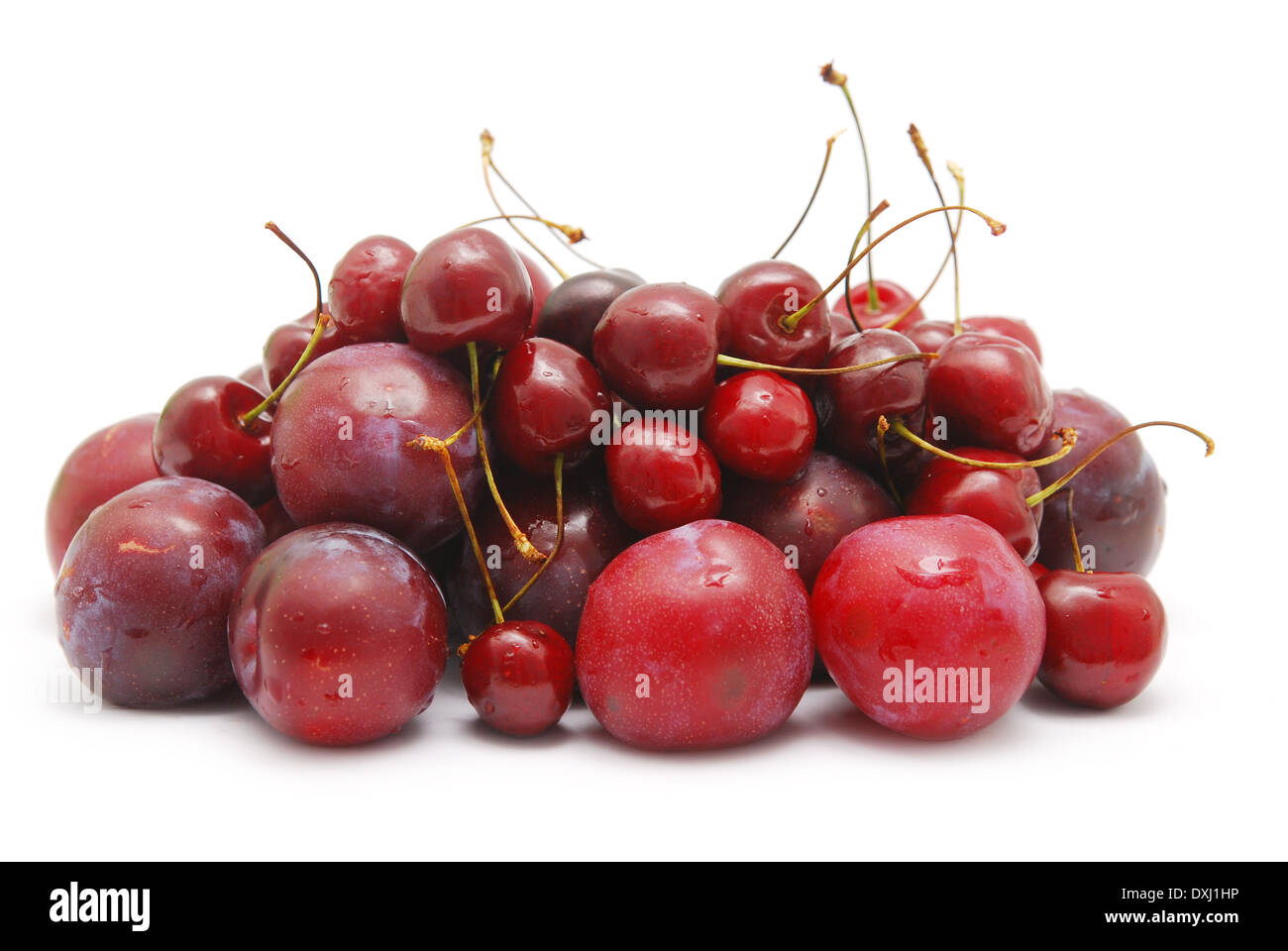plums and cherry isolated on white Stock Photo