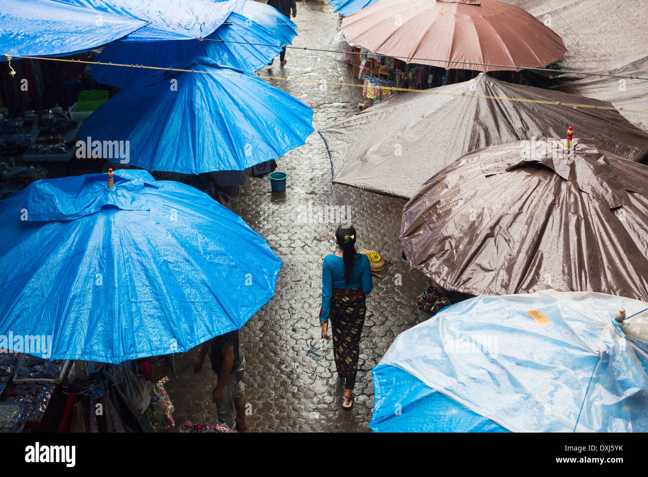 Rain falling over tarps and awnings of market stalls, Ubud, Bali, Indonesia Stock Photo