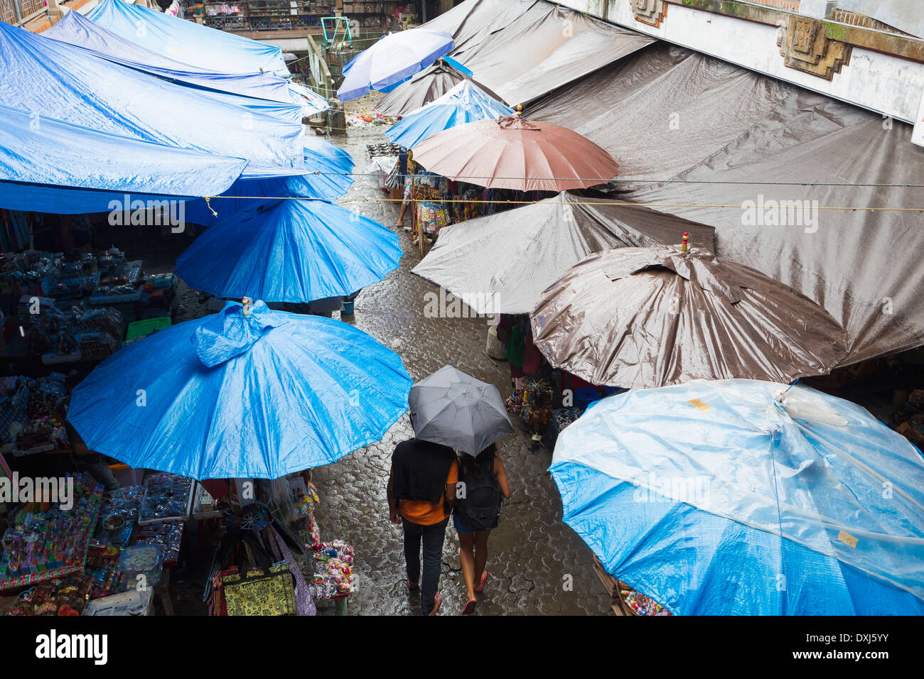 Rain falling over tarps and awnings of market stalls, Ubud, Bali, Indonesia Stock Photo