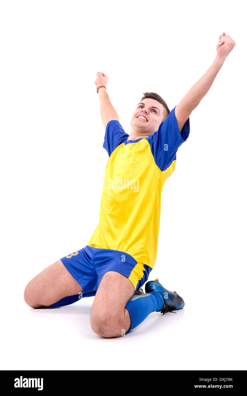 Football player celebrating a goal isolated in white Stock Photo