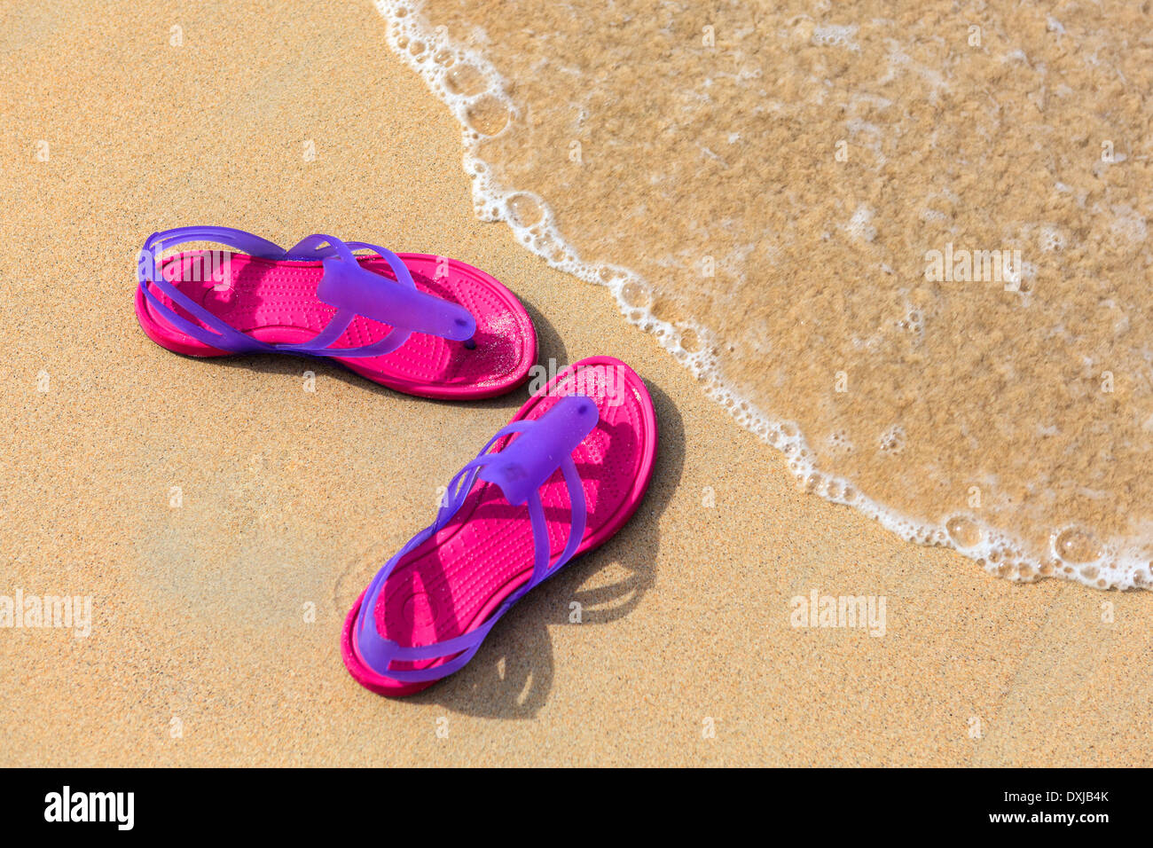 Sandals on the beach - concept image Stock Photo - Alamy