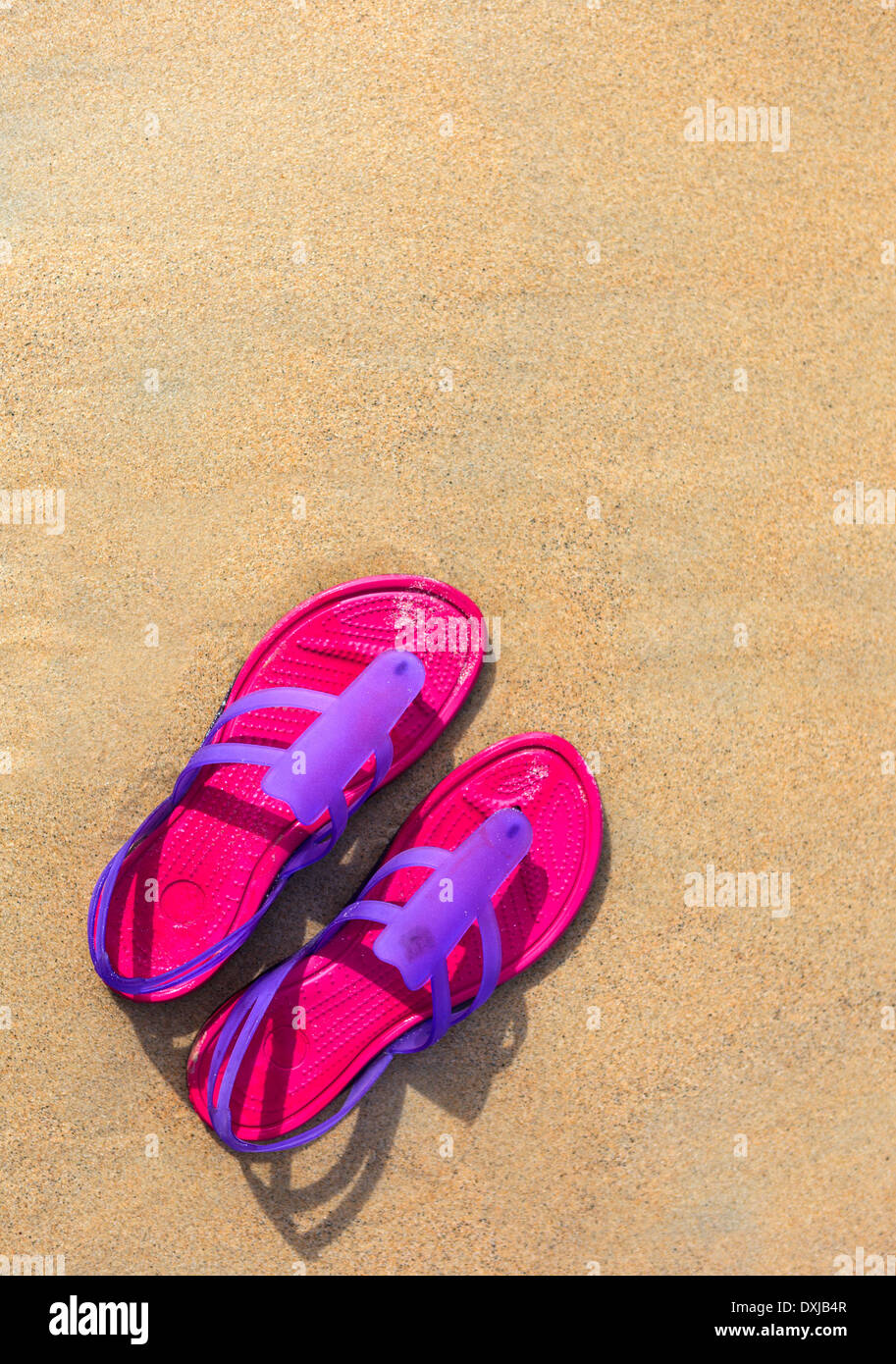 Sandals on the beach - concept image Stock Photo - Alamy
