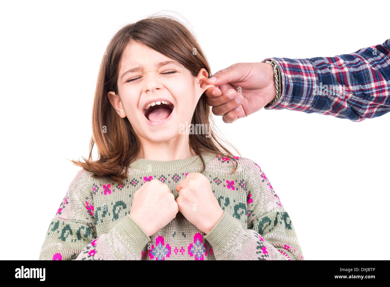 Young girl being punished with ear pulling Stock Photo