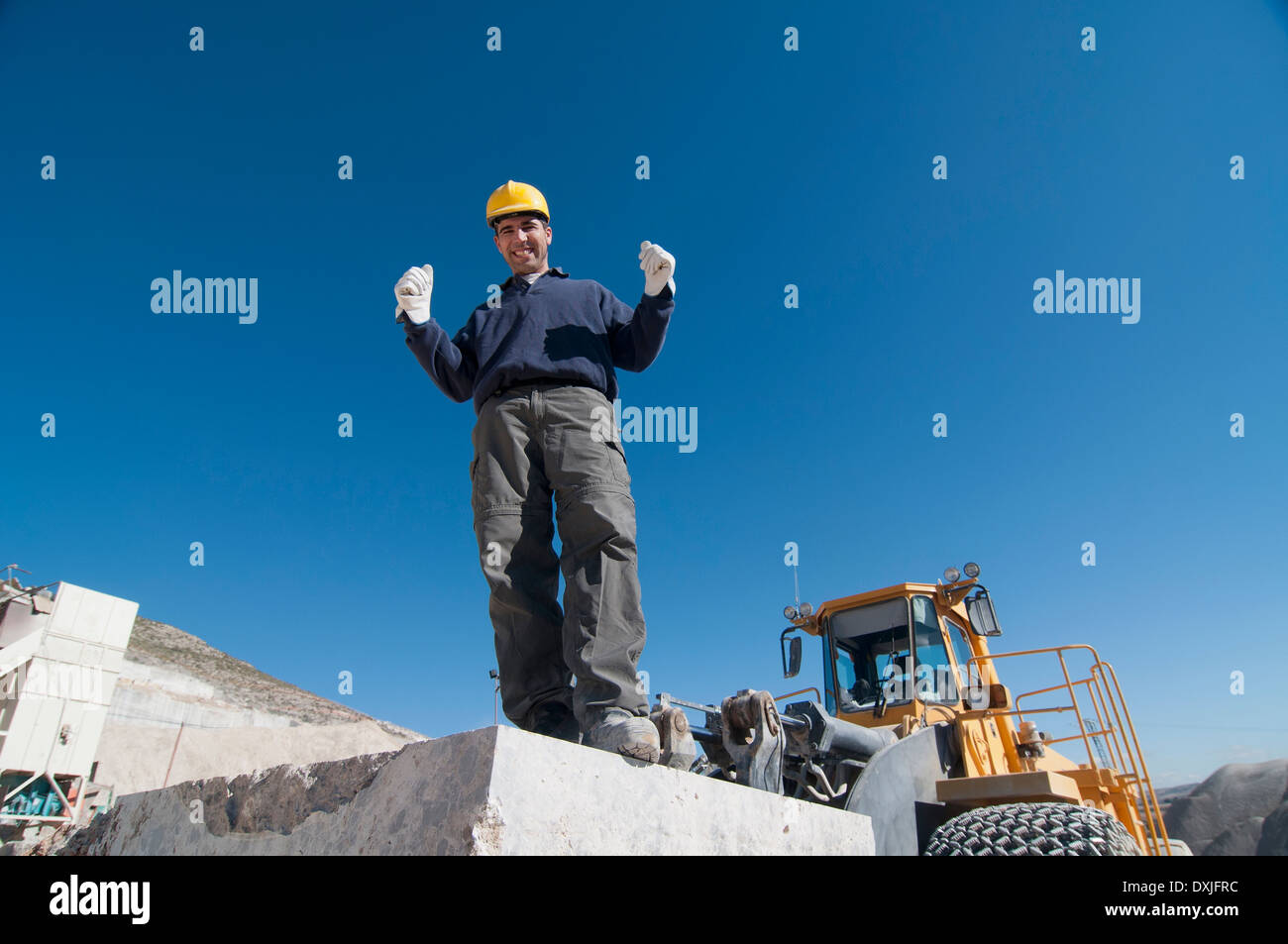 joyful worker on top of marble slab in quarry Stock Photo Alamy