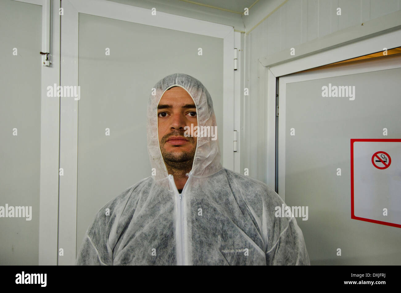man in safety coverall in food processing plant Stock Photo