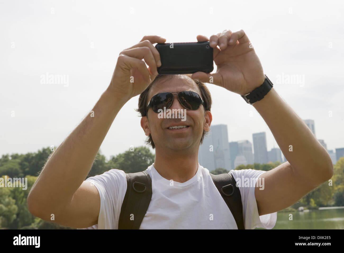 Pusle Using His Camera Tourist using camera phone hi-res stock photography and images - Alamy