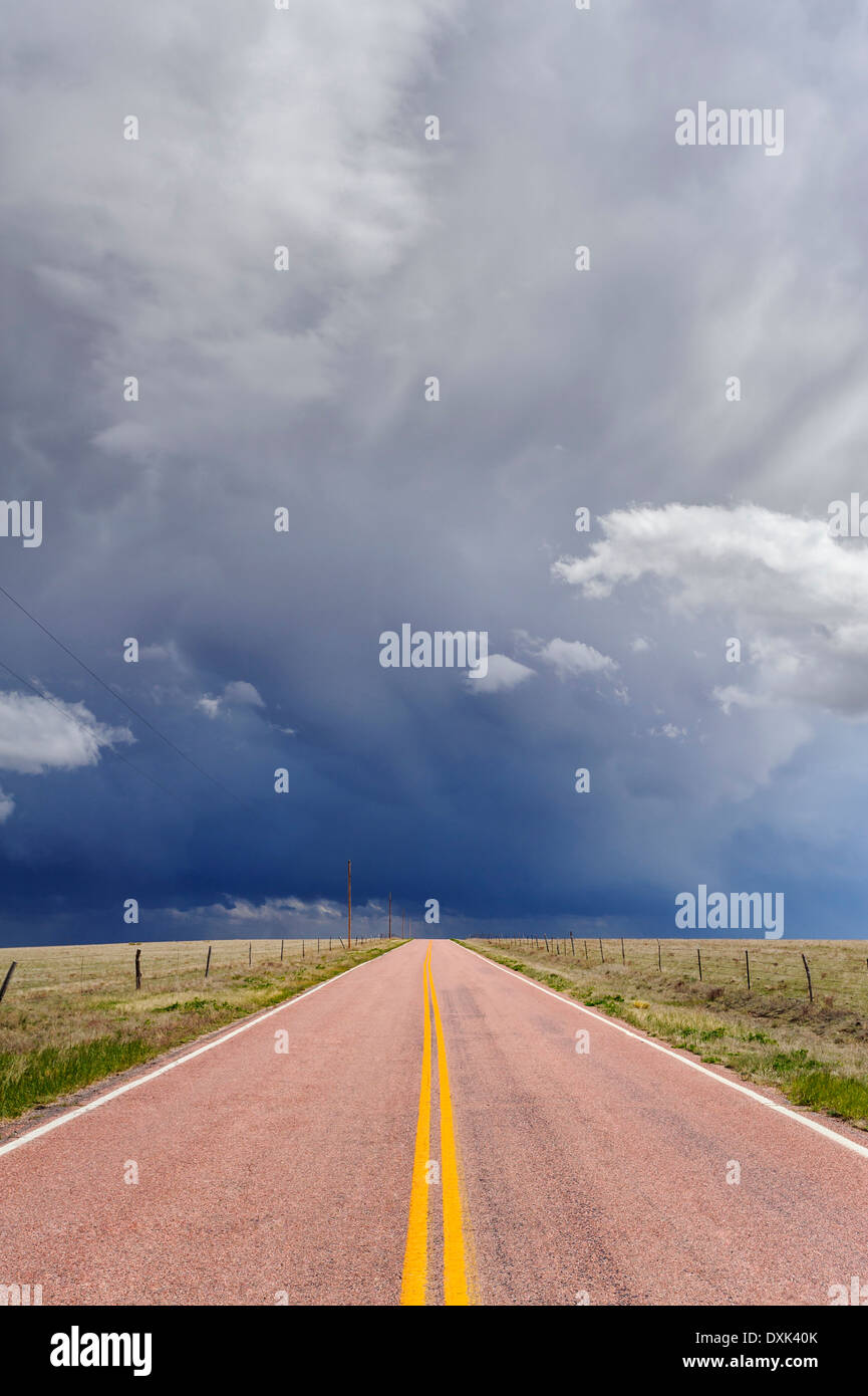 Storm clouds over open road, Rush, Colorado, United States Stock Photo