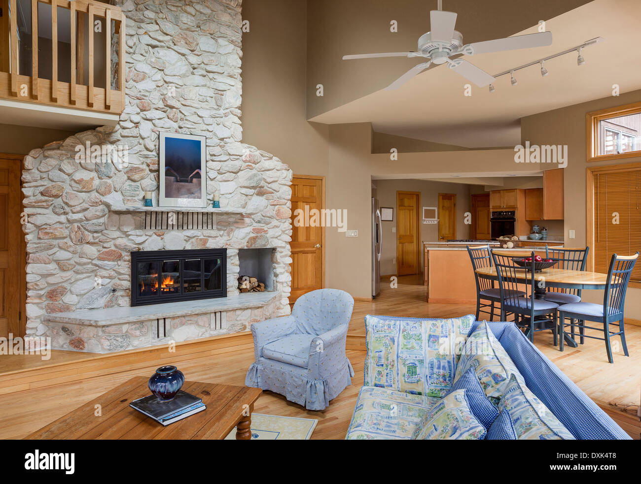Stone fireplace between living room and dining room Stock Photo Alamy