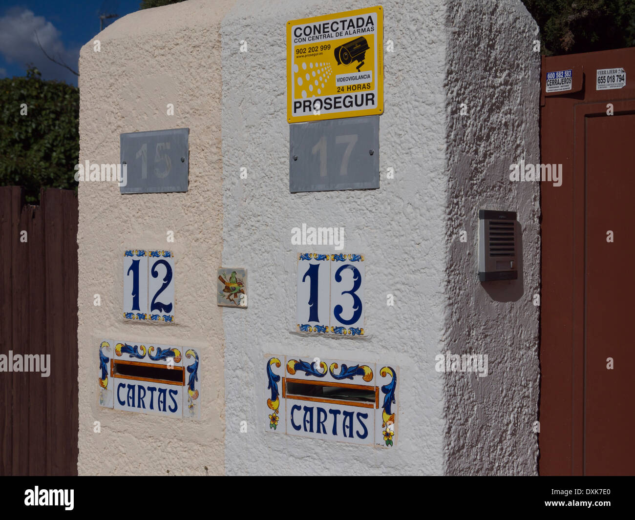 House numbers with letterboxes and the word Cartas which means Letters. Stock Photo