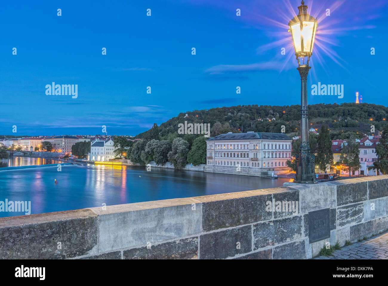 Streetlamp illuminated on Charles Bridge at dawn, Prague, Czech Republic Stock Photo