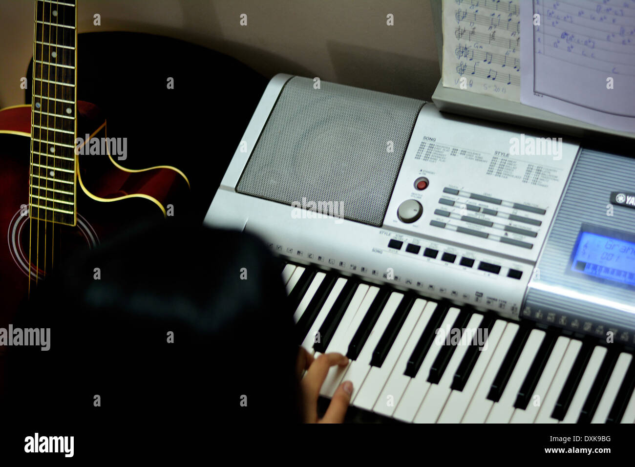 girl playing keyboard Stock Photo