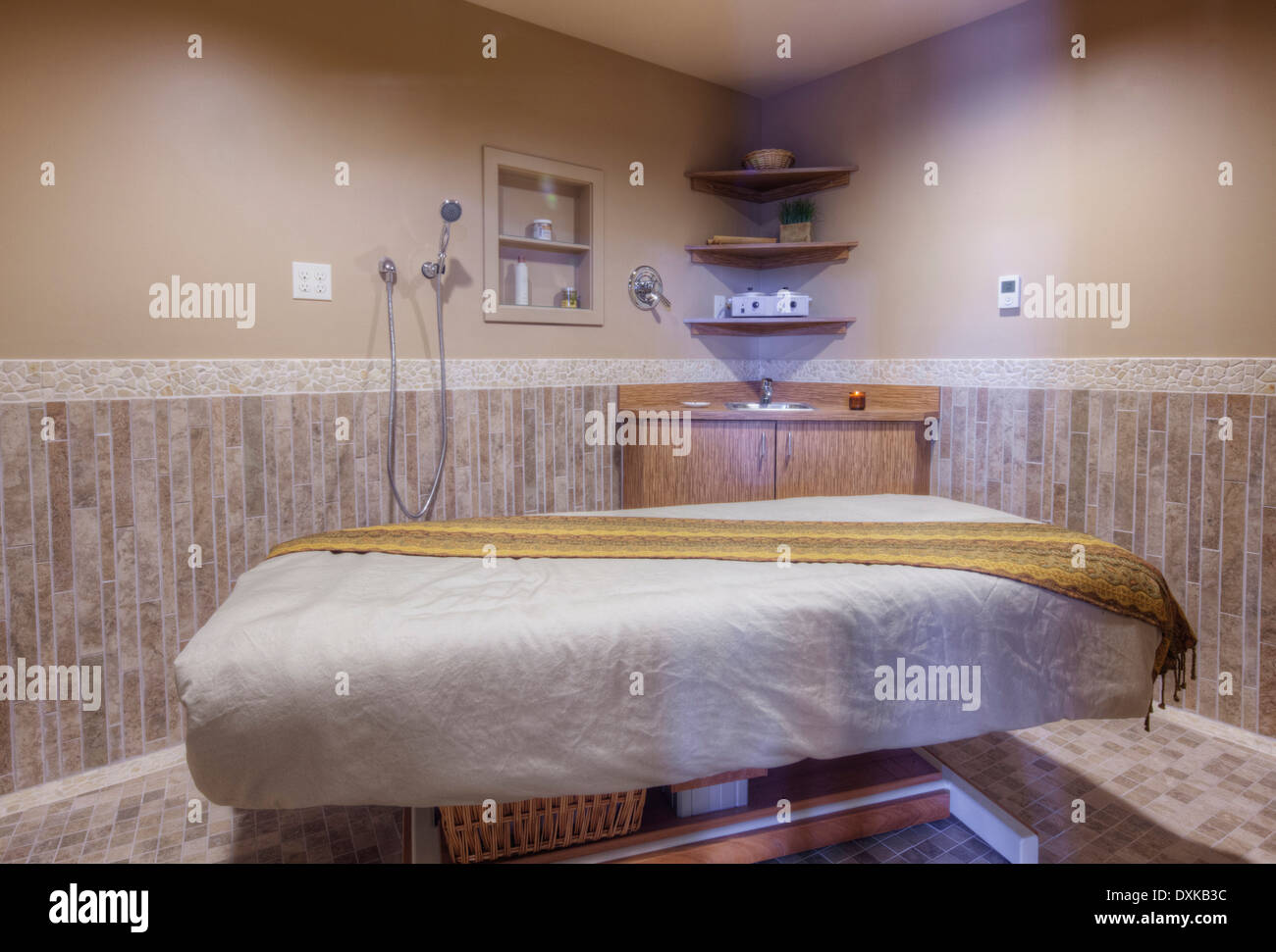 Massage table in beauty salon Stock Photo