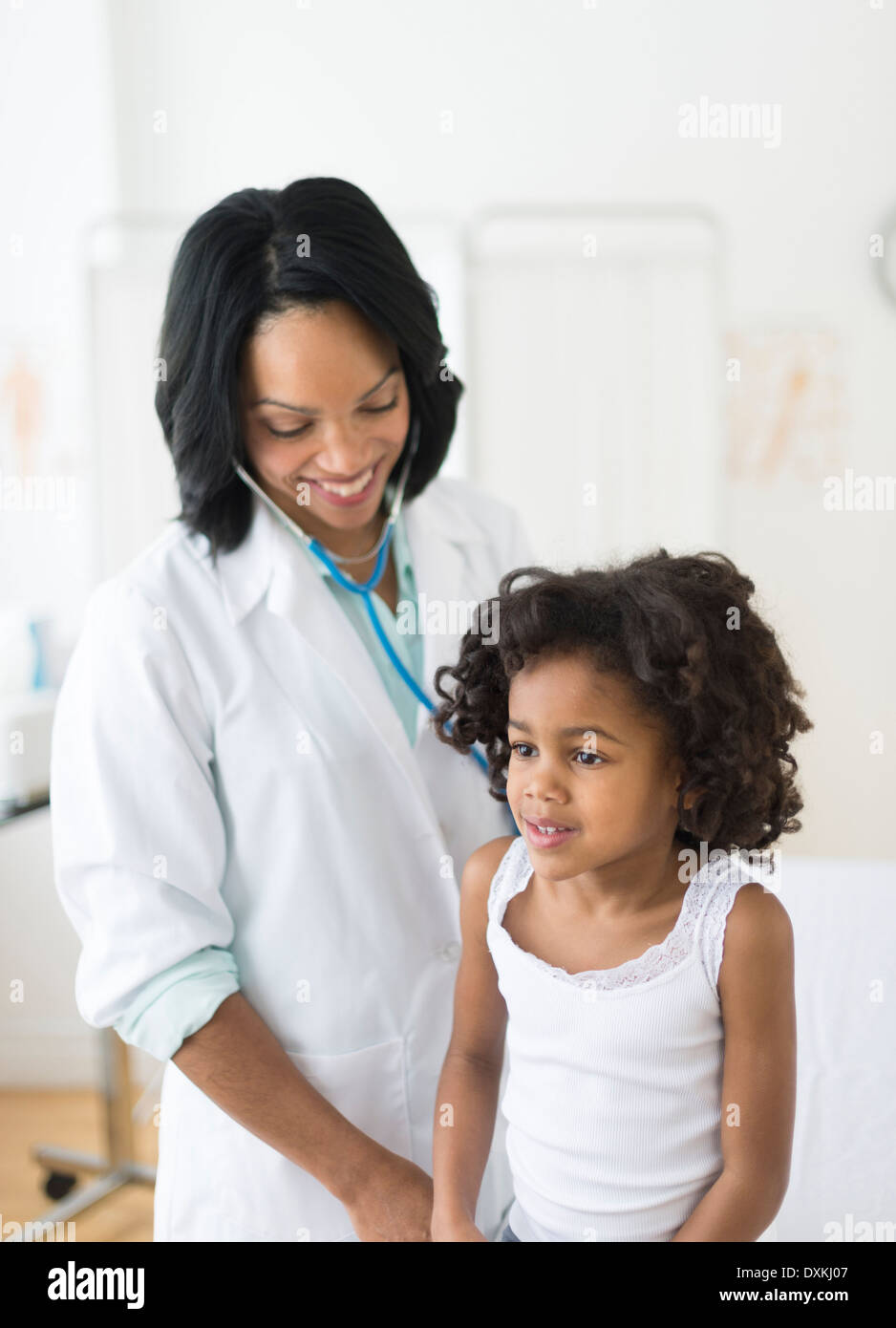 African American girl receiving checkup from doctor Stock Photo