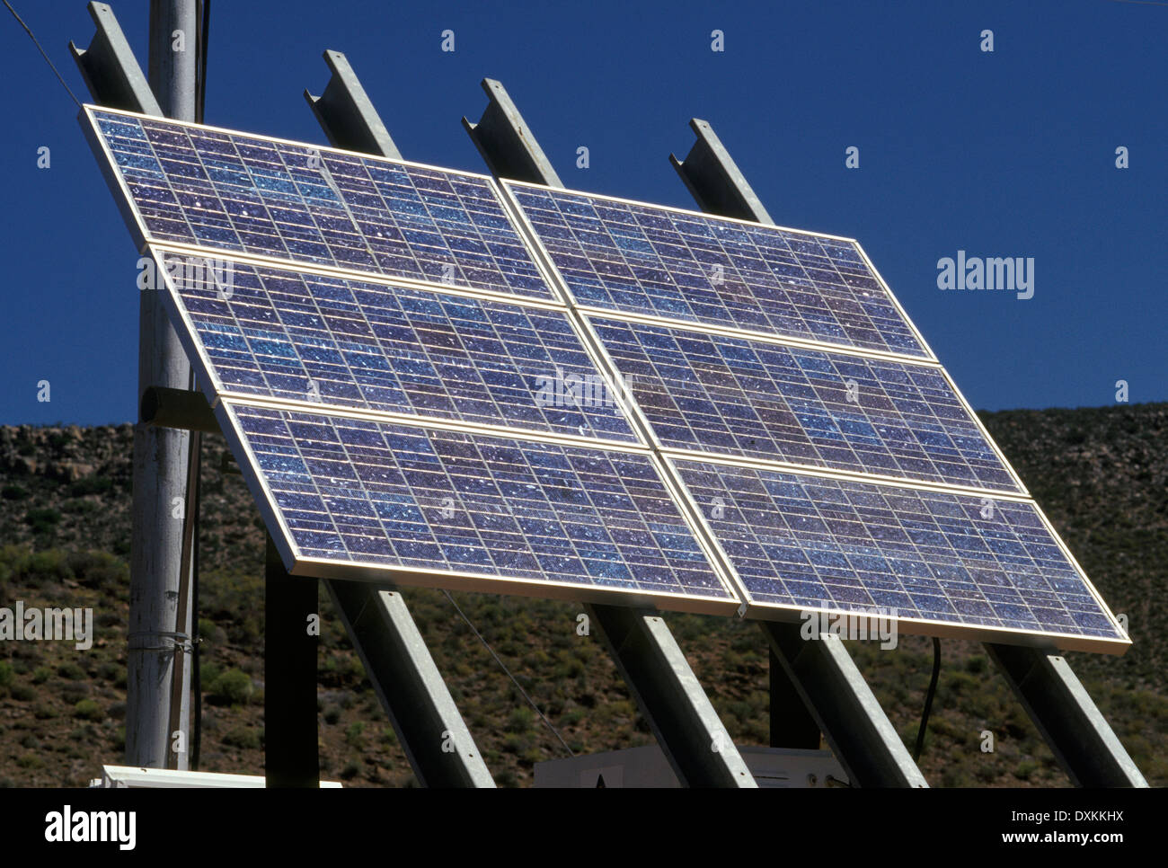 Solar panel powers remote device in mountains Stock Photo