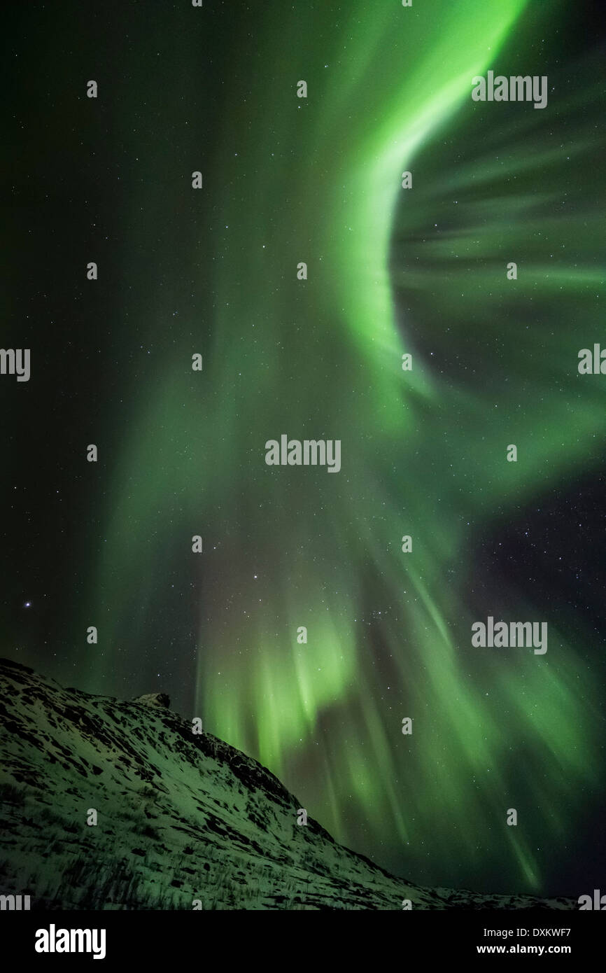 Aurora borealis or northern lights moving across night sky within the ...
