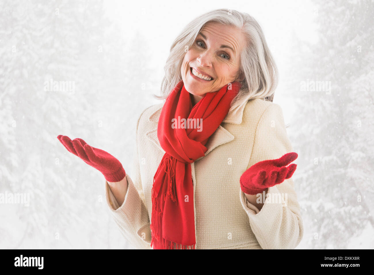 Portrait of shrugging Caucasian woman in warm clothing Stock Photo