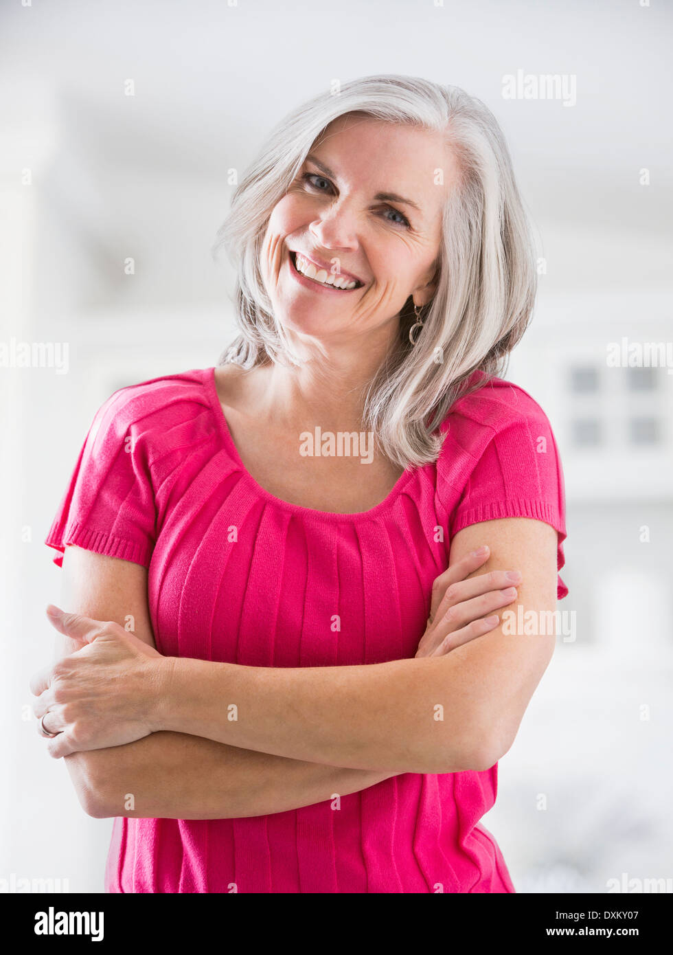 Woman arms crossed not laughing hi-res stock photography and images - Alamy