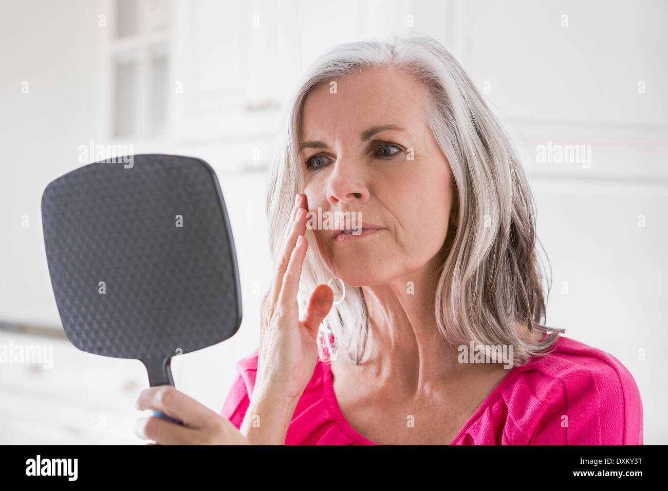Woman mature face skin mirror hi-res stock photography and images - Alamy
