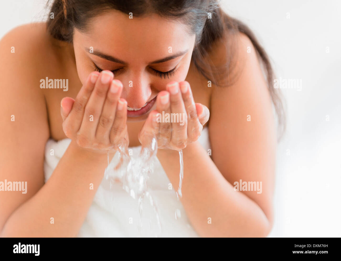 Close up of Asian woman washing face Stock Photo