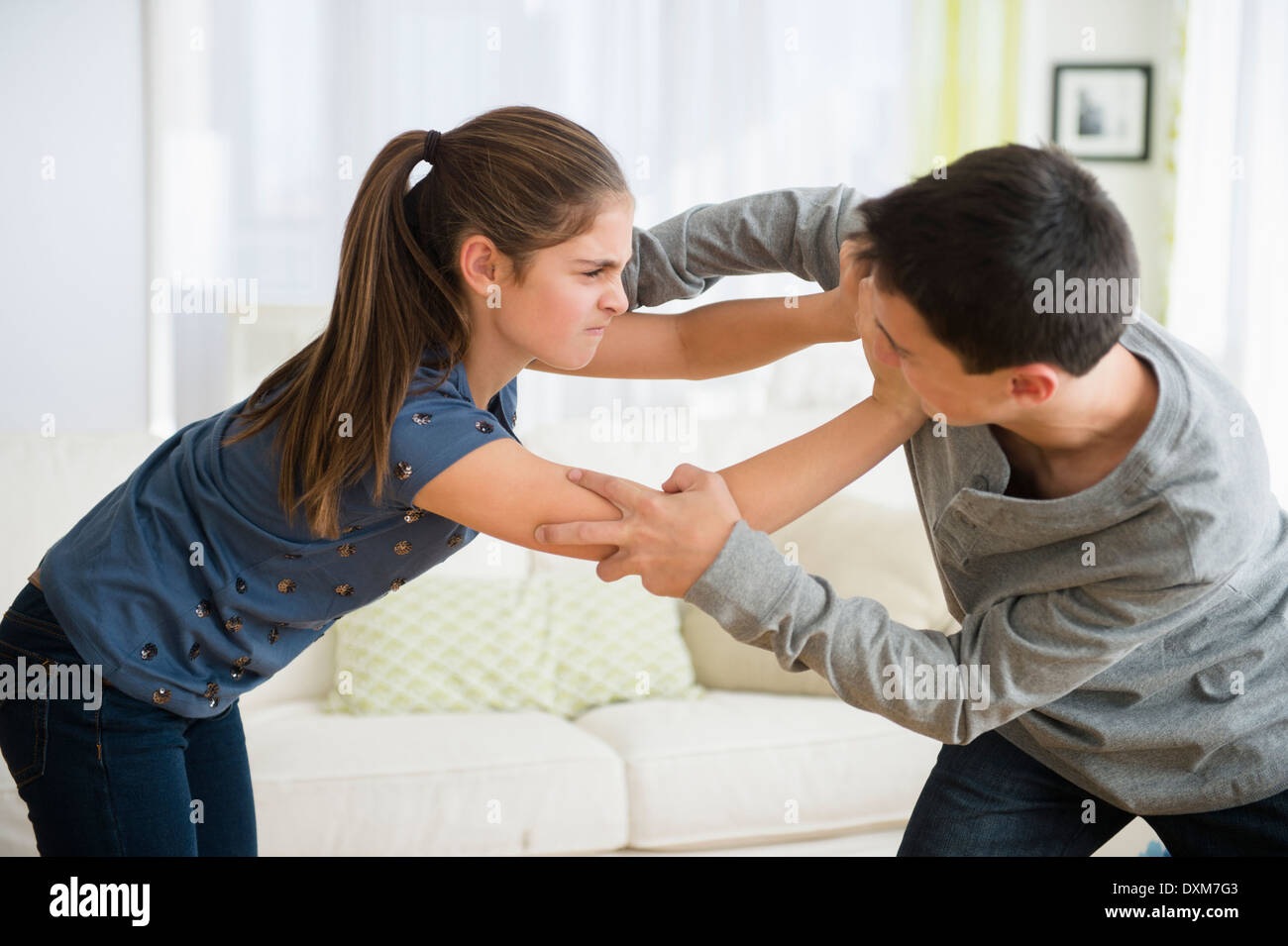 Caucasian brother and sister fighting Stock Photo
