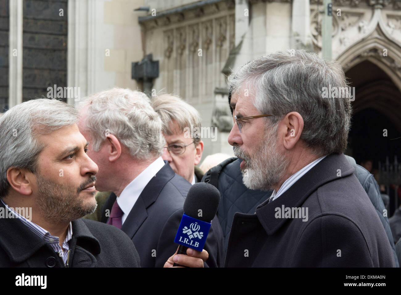 London, UK . 27th Mar, 2014. President of Sinn Féin Gerry Adams (right) is interviewed after the funeral service of Tony Benn. Tony Benn was a British Labour politician and a Member of Parliament (MP) for 47 years between 1950 and 2001. He died at the age of 88. Credit:  Patricia Phillips/Alamy Live News Stock Photo