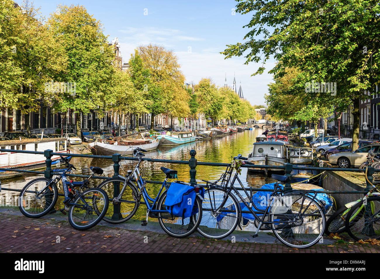 Amsterdam cycles bikes canal bridge hires stock photography and images